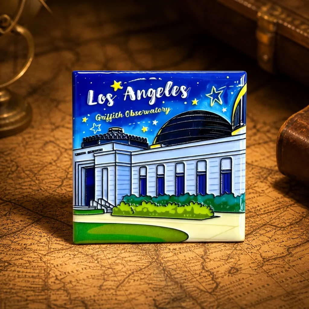 Custom ceramic Los Angeles souvenir fridge magnet on a dark travel map