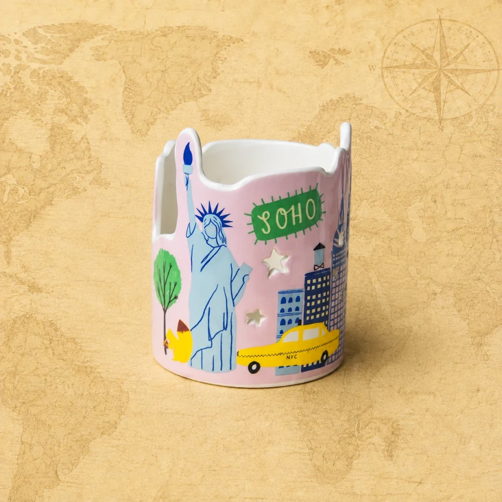 Ceramic souvenir candle holder featuring New York City, USA skyline landmark theme