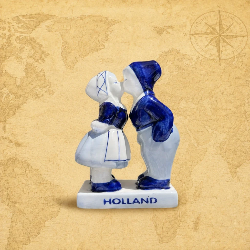 Ceramic souvenir figurine featuring Delft Blue kissing couple, Netherlands