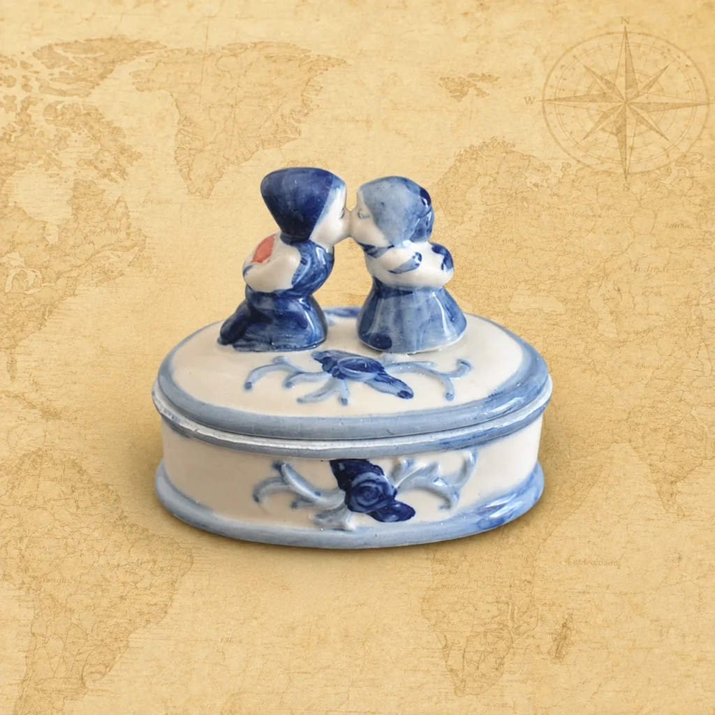 Ceramic souvenir jewelry box featuring Delft Blue kissing couple, Netherlands