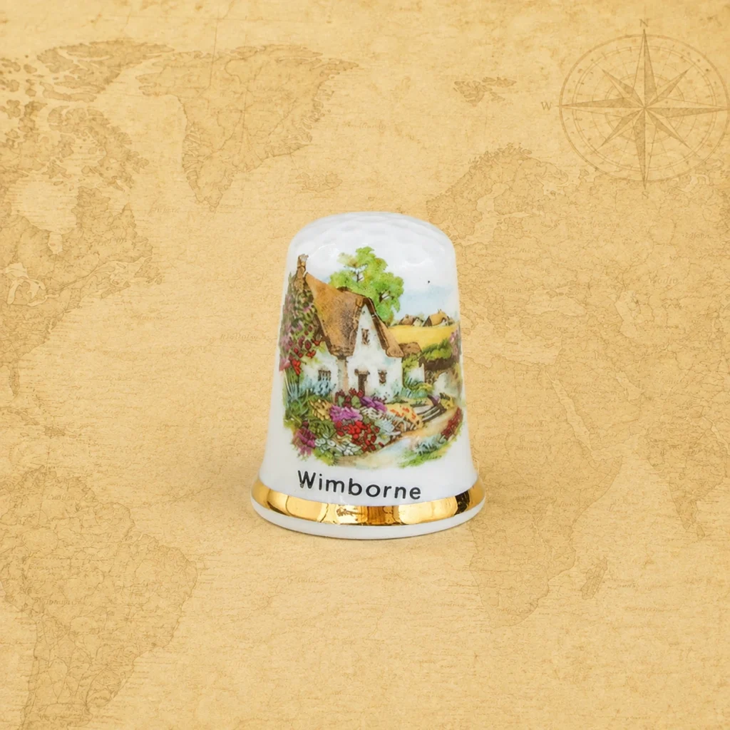 Ceramic souvenir thimble featuring Wimborne in Dorset, England, United Kingdom