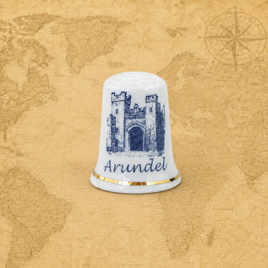 Ceramic souvenir thimble featuring Arundel in West Sussex, England, United Kingdom