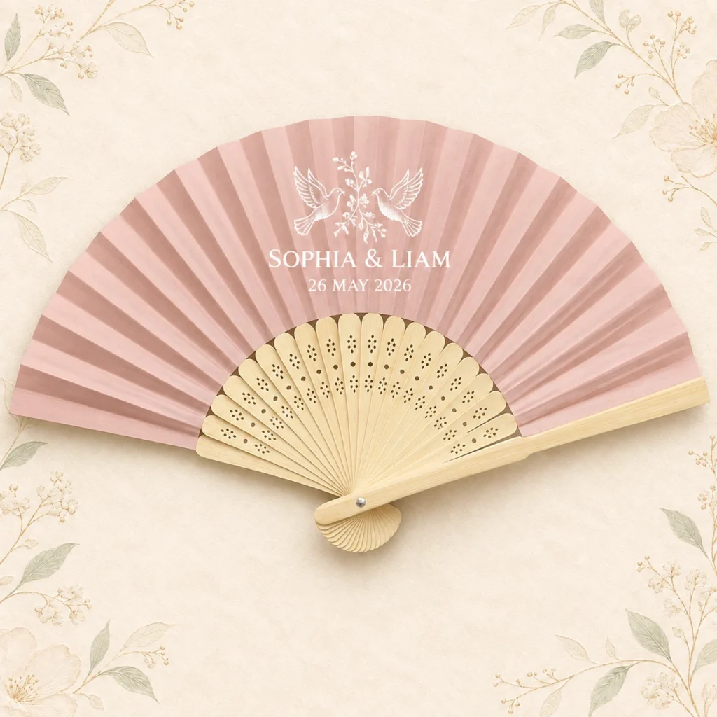 Blush personalized bamboo wedding hand fan with Sophia and Liam names and May 2026 date