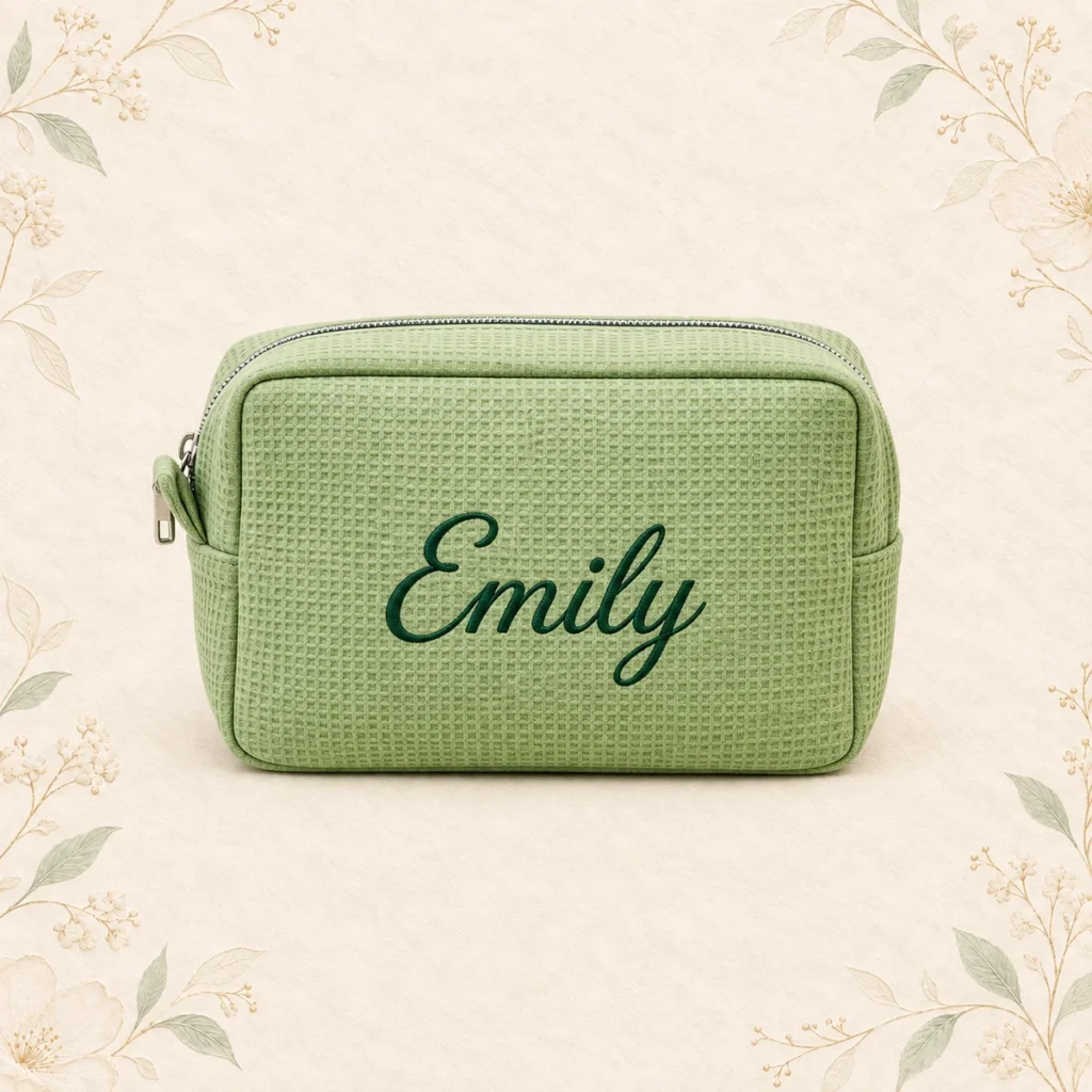 Sage waffle cosmetic bag embroidered with Emily