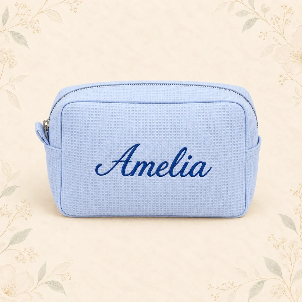 Dusty blue waffle cosmetic bag embroidered with Amelia