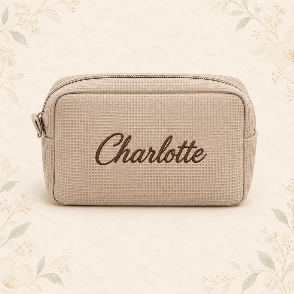 Champagne taupe waffle cosmetic bag embroidered with Charlotte